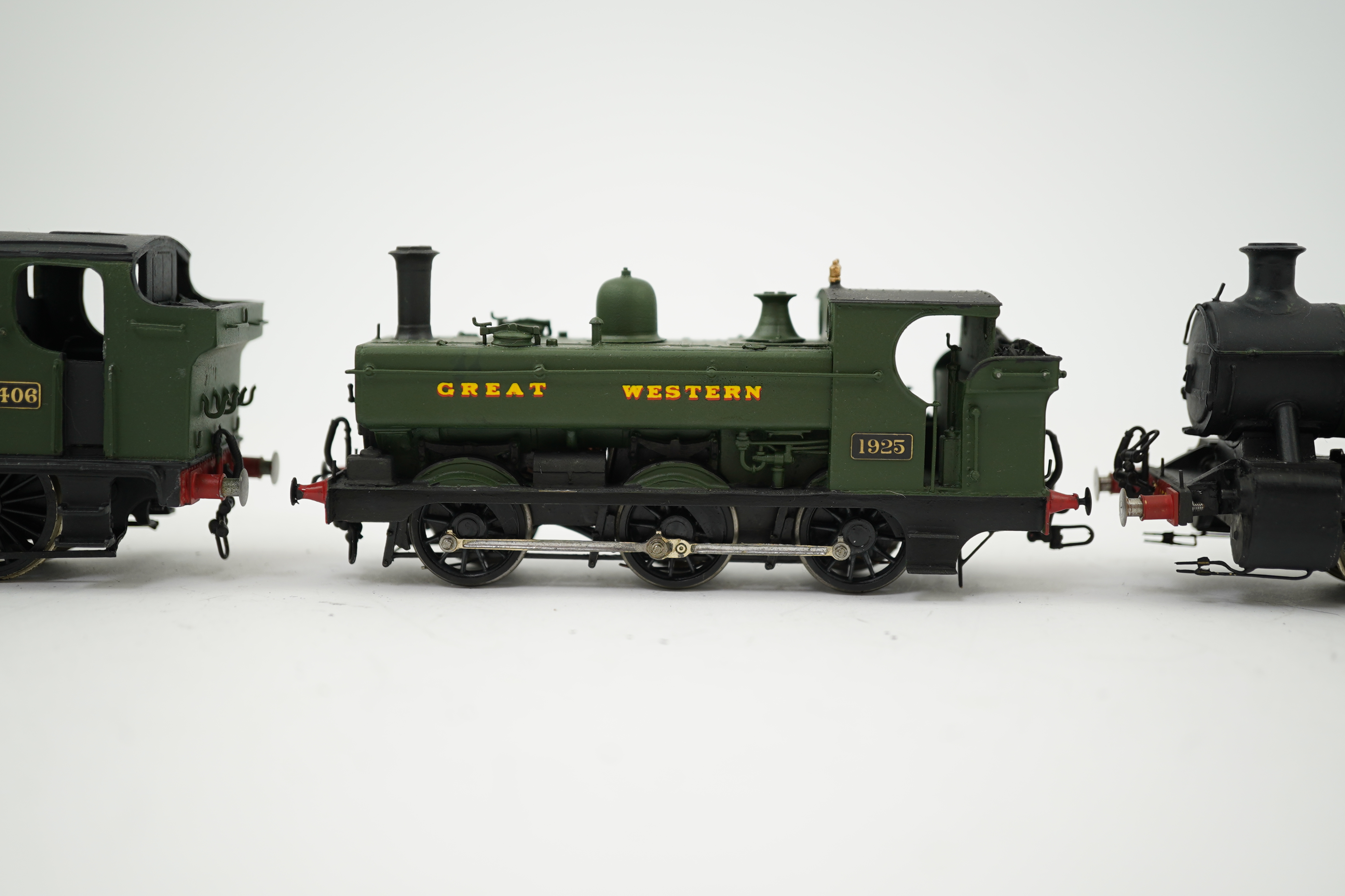 Three 00 gauge brass and white metal kit built GWR tank locomotives; a 15xx class 0-6-0T, 1500, together with an 54xx class 0-6-0PT, 5406, and a 19xx class 0-6-0PT, 1925, all constructed, painted and lined to a high stan